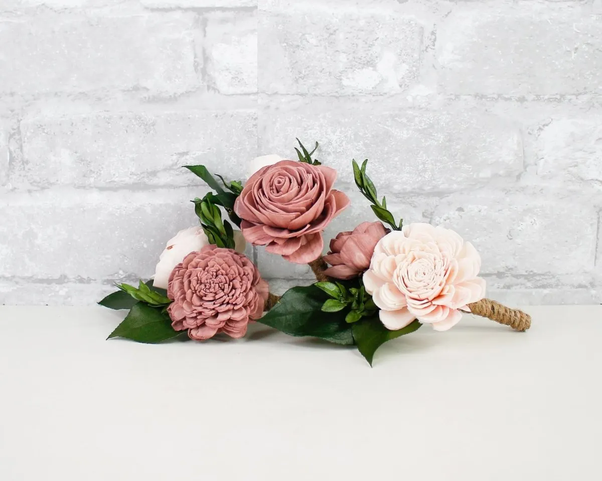 Three custom boutonnieres in dusty rose and blush