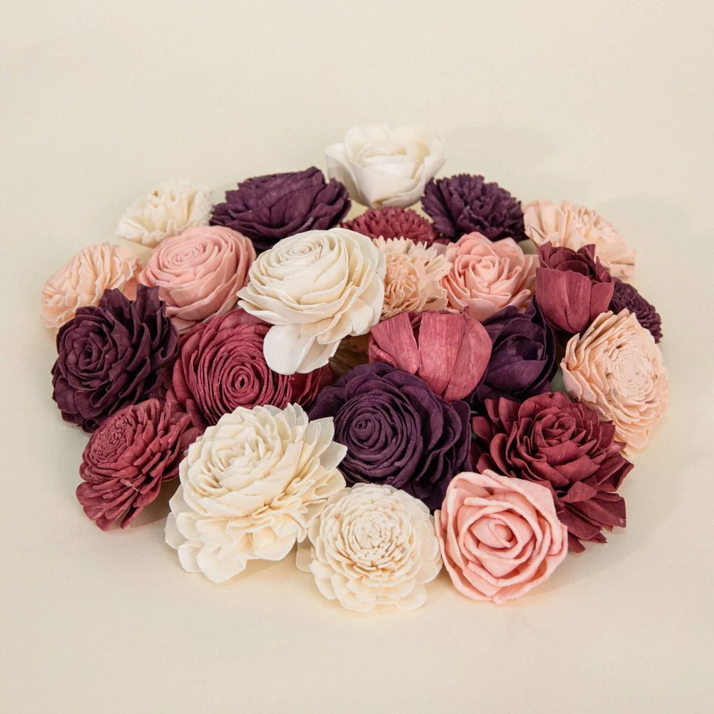 Loose dyed wood flowers in burgundy, eggplant, pink and cream