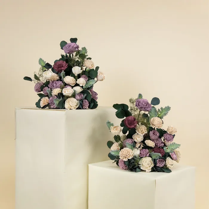 Two Luxe Lavender free standing arrangements on cream plinths
